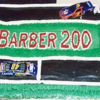 Barber 200 Race I made this cake for my twin boys 2nd birthday. It is a 13x9 standard cake with a 9" round cake, cut in half and placed on the ends. I...