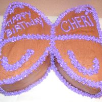 Butterfly Birthday Cake Made a chocolate cake with chocolate BC, one wing has kahlua mousse, the other has cheescake mousse filling. Piped with BC. For our office...