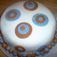 Retro Anniversary Cake This is my first ever fondant cake. It is a yellow cake with buttercream. I made it for my husband. He loves anything retro. I made 4...