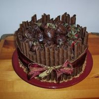 Chocolate Covered Strawberry Cake Dark Choc cake, Choc BC icing w/ choc chips in it, hand dipped strawberries on top, choc creme filled pirouette cookies around the edges...