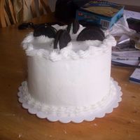Oreo Cake I mixed 12 crushed oreos in a white cake mix. then I decorated the cake with oreo's an snow white butter cream it was good