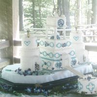 Medeival Castle Wedding Cake I did this cake for my niece's medieval wedding. This castle is complete with a moat and drawbridge. Castle is square and the bell...