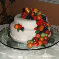 Tusican Wedding I loved making all the little fruit even thought it took forever. All the fruit is made from MMF and the cake it also covered in MMF. The...