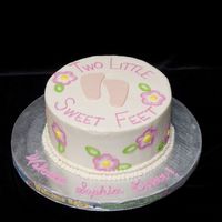 Two Little Sweet Feet 10" WASC with raspberry filling. BC icing, brushed embroidery. Candy clay feet. Thank you so much to whomever had the original from...