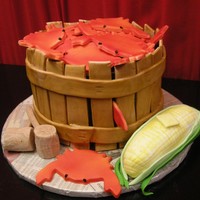 Another Crab Bushel This is about my 5th bushel cake but I think it turned out the best. The bushel is three stacked 9inch round cakes. The strips are made out...