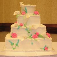 Dscn0998.jpg I made this cake for my cousin's wedding. The color choices were all hers, I loved the lillies, not bad for a first time, I think.