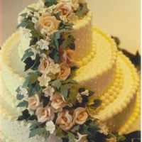 Gumpaste Roses gumpaste roses cascade. Buttercream frosting and almond flavored white cake.