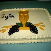 First Communion yellow candy clay is used for challis and then gold petal dust. The candy clay was draped over some frosting to hold shape The young man...