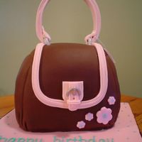 Handbag Birthday Cake I made this cake for my mom for her birthday. I just finished my Wilton Course 1. This was my first time working with fondant, so it was a...