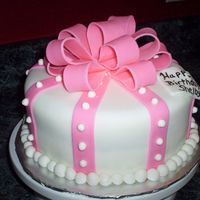 Shelby's Birthday Cake White fondant covered butter cake with royal icing dots and fondant ball border. The gift tag is white fondant with food marker writing. My...