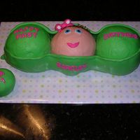 Sweet Pea Peas in a pod for a first birthday. Made from sports ball mold. Buttercream with fondant. Smash cake covered in buttercream with fondant...