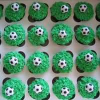 Soccer Cupcakes I made 85 cupcakes for my friends son's birthday party. Used the grass tip and plasitc soccer balls.