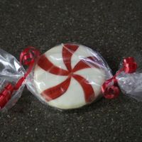 Peppermint Anyone!!! Just your basic round cookie iced in Modified royal, then hand painted with airbrush colors when dry! I then just cut the sealed end off of...