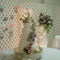 Fresh Flower Wedding Cake The cake is 5 tiers of beauty. A very pale pink buttercream icing exactly matches the color scheme of the wedding and reception and...