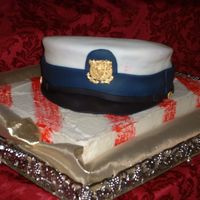 Coast Guard Hat This was for a man graduating from Coast Guard boot camp. Everything is edible even the gold medallion and buttons.