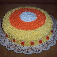 Candy Corn Cake Candy Corn Cake, the cake is white, orange, and yellow inside, decorated in BC icing, and candy corn's.