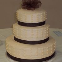 Ivory And Chocolate Wedding Cake 14", 10" and 8" iced in buttercream.