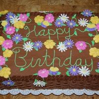 Birthday Celebration Chocolate cake with chocolate buttercream. I had a lot of fun making all the different kinds of flowers.