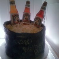 Beer Bottle Cake Sack is fondant painted in blue luster dust. Sam Adams Beer bottles are made of sugar with rice paper labels. Ice chips are isomalt! :)...