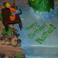 Fishing Birthday Cake Yellow cake and Buttercream. RKT fish covered MMF. Chocolat modeling clay pier.