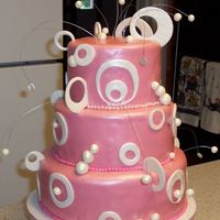 Pink Circles This is the "16" Birthday Cake I started just a few days ago. The customer found the idea from Charm City Cakes. This is three...