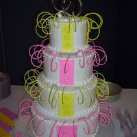 Pink And Yellow Wedding Cake This cake is kinda crazy for a wedding, but it''s what the customer wanted, so...buttercream with fondant accents