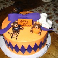 Halloween B-Day i had so much fun with this cake. i loved the bears so much i almost wanted them back! combined a couple of different cakes on cc to design...