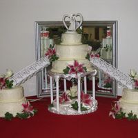 Picture_164.jpg all buttercream. thought the florist turned it into a floral arrangment instead of just a wedding cake. more flowers put on after i left...