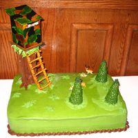 Deer Stand Cake so much fun. got the idea from a pic on cc. thanks! tree trunk was pretzel rods glued with royal icing and covered with chocolate bc. trees...