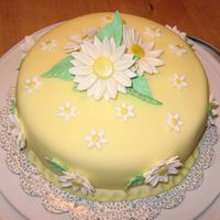 Daisy Cake This cake is from my last Wilton class. It's covered in fondant with gumpaste flowers & leaves.