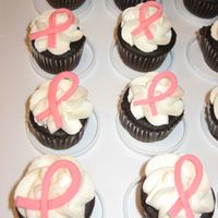 Pink Ribbon Cupcakes Chocolate mini cupcakes with buttercream icing and fondant ribbons. I made these for a breast cancer fundraiser.