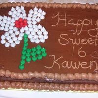 Kissables Birthday Cake Yellow cake with chocolate pudding filling, chocolate syrup frosting, with wilton chocolate decorators frosting as accent; flower made with...