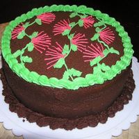 Lehua Cake Chocolate cake w/ strawberry cream filling, very yummy. Design is the Hawaiian Lehua blossom.