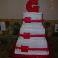 Heather's Wedding Cake Square cake with fondant ribbon accents with buckle. Cake topper was made from royal icing.