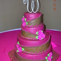 Round Brown/maroon Wedding Cake all buttercream icing with royal icing flower accents