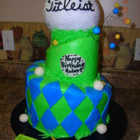 Whimsical Golf Birthday Cake Whimsical, 3 tiered golf ball topped birthday cake iced in buttercream with fondant accents.