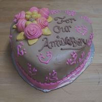 Anniversary Cake This was made for a coworker's anniversary. I used two cakes I found in the gallery and combined them. Everything's chocolate-...
