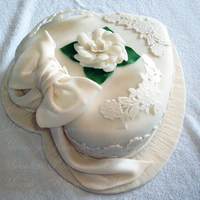 Romantic Cake 11" heart shaped cake made from five layers of different types of cakes and chocolate filling.The cake is covered in fondant and the...