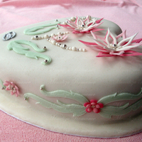 Heart And Fantasy Flowers Cake 10 chocolate cake with chocolate ganache filing and covered in fondant. The flowers were made from gum paste. TFL