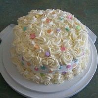 My Mom's 92Nd Birthday Cake Strawberry Poke Cake w/ Cool Whip and sliced strawberry filling. Frosted w/ Cool Whip and Whipped Cream Rosettes.