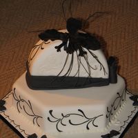 Bat Flower A competition entry. I received a silver certificate. The design on the side is RI stenciling. The bat flower is form gumpaste