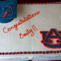 Auburn Graduation Cake Full sheet, yellow cake w/BC icing. Graduation hat was half of the Wilton Sports ball pan with a piece of cardboard iced for top.