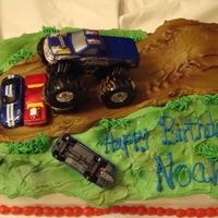 Monster Truck Monster Truck Cake, buttercream icing airbrushed with toy monster truck and cars