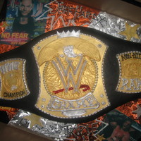 Wwf Wrestling Belt I baked a carved a 1/2 sheet cake for this. The client supplied a toy belt for sizing. As it turned out the 1/2 sheet was a little short so...