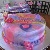 Barbie And The Diamond Castle the little girl wanted pink and purple and a tiny bit of yellow. The barbie and mirror are cake toppers she also wanted on it.