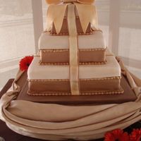 Tiffany Gift Box 14", 10", 6" Fondant Tiffany Gift Box style cake. Brown and Tan/Cream coloered with handpainted gold fondant beading....