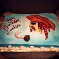 Aaarrgh Matey 1/2 sheet cake iced in Buttercream, airburshed background blue with lusterdust, used KopyKake projector for Pirate image, White chocolate...