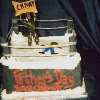 Fathers Day Smackdown This is my DH fathers day cake all is edible except the yarn I used as ropes and my "DH" the champ. I covered pretzel rods with...