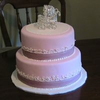 Baby Shower Fondant cake with pink ribbon. The customer bought the carriage to be put on the top. Thanks for looking:)