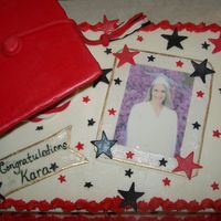 Graduation Cake I had to make 3 graduation cakes for the same party. This is one of them. Edible image with fondant cap and accents. Thanks for looking!